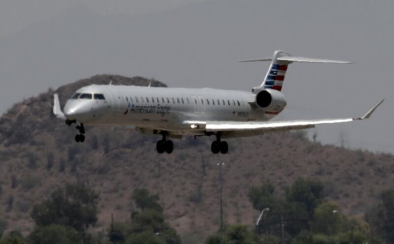 An American Eagle jet seen through heat ripples in Phoenix (Matt York/AP)