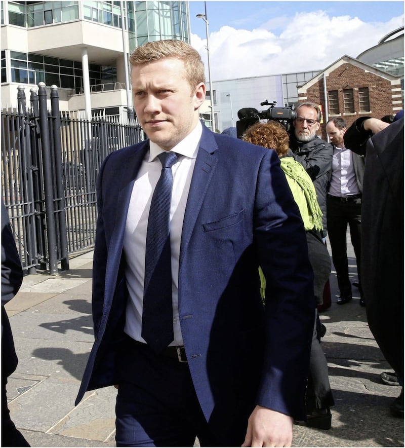 Stuart Olding lon the wayout of court in Belfast not guilty Picture By Hugh Russell. 