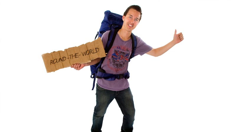 Hitchhiker with backpack and sign