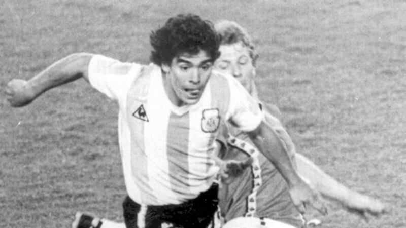 Argentina's Diego Maradona evades a lunge from Belgium's Guy Vandermissen during the opening game of the 1982 World Cup.