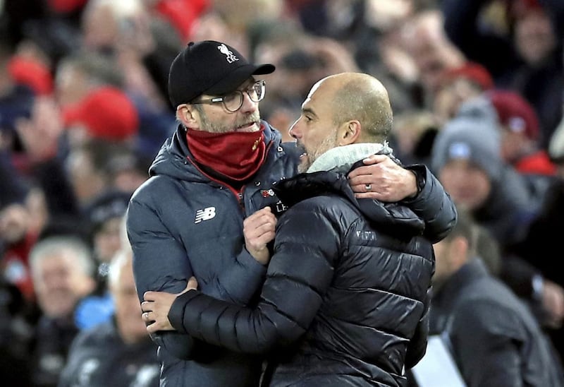 Liverpool manager Jurgen Klopp (left) and Manchester City manager Pep Guardiola..