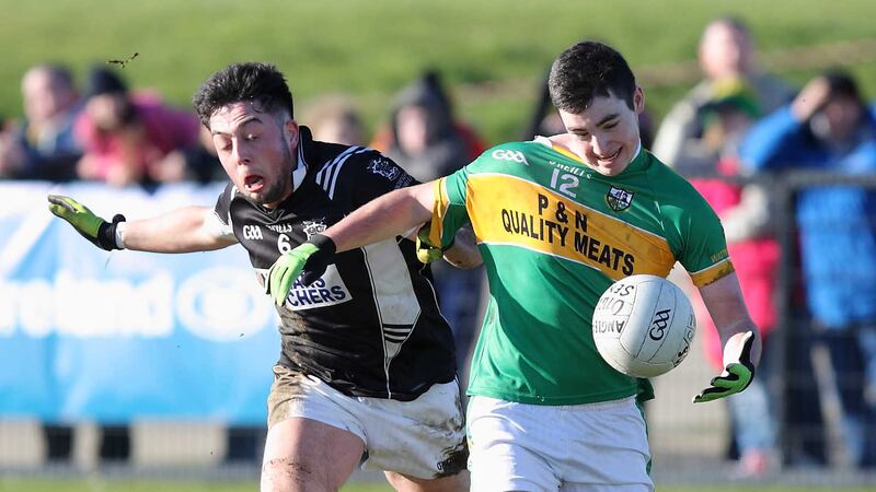 Danny Tallon from An Gleann is challenged by Killian Rudden of Misteal Machaire Cluain during Sunday's semi-final <br />Picture by Cliff Donaldson&nbsp;