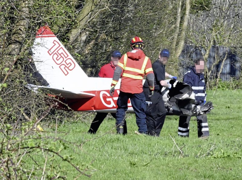 The Air Accident Investigation Branch and emergency services removed the wreckage of the Cessna 152 light aircraft from a field near Nutts Corner on Saturday.Picture by Alan Lewis/ PhotopressBelfast 