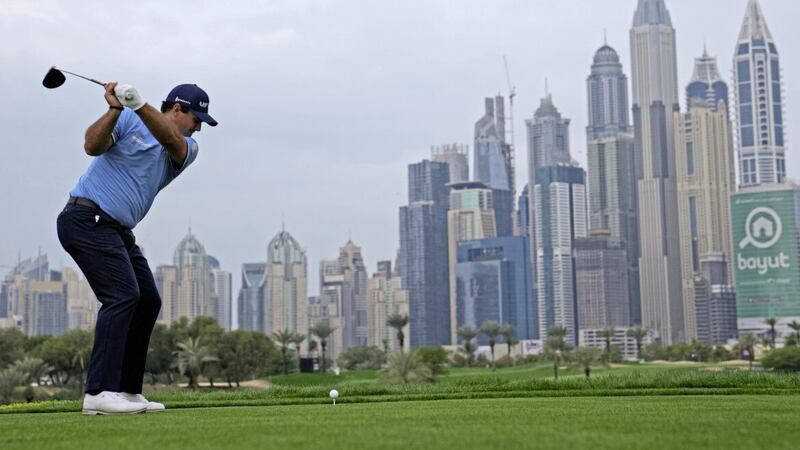 Patrick Reed of The United States tees off on the 8th hole during the first round of the Dubai Desert Classic, in Dubai, United Arab Emirates, Thursday, Jan. 26, 2023. (AP Photo/Kamran Jebreili) 
