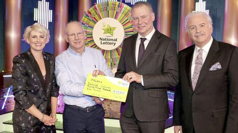 Inishowen man, Pauric Collum (second from left) became the third member of his family to taste Winning Streak success when he appeared on the RT&Eacute; show last month. He was presented with his &euro;23,000 winnings by Irish Nation Lottery chief executive, Dermot Griffin and joined by show hosts, Sine&aacute;d Kennedy and Marty Whelana. Picture by Mac Innes Photography. 