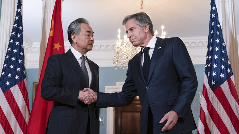 Secretary of state Antony Blinken shake hands with China’s foreign minister Wang Yi after a bilateral meeting in Washington (Jose Luis Magana, AP)