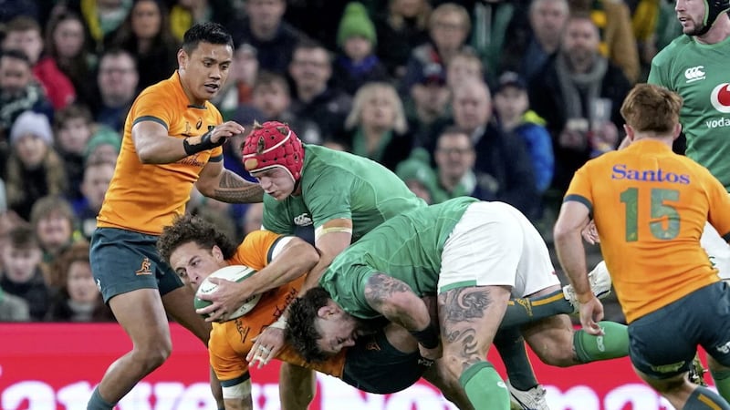 Australia&#39;s Mark Nawaqanitawase is tackled by Ireland&#39;s Josh Van Der Flier (centre) and Andrew Porter during the Autumn International match at the Aviva Stadium in Dublin, Ireland. Picture date: Saturday November 19, 2022. 