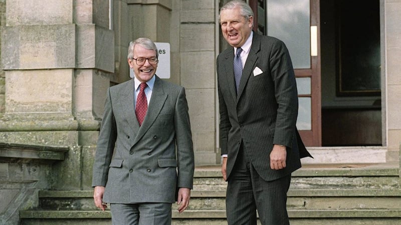 Former British prime minister John Major has a laugh with his secretary of state for Northern Ireland Sir Patrick Mayhew on the steps of Stormont Castle 