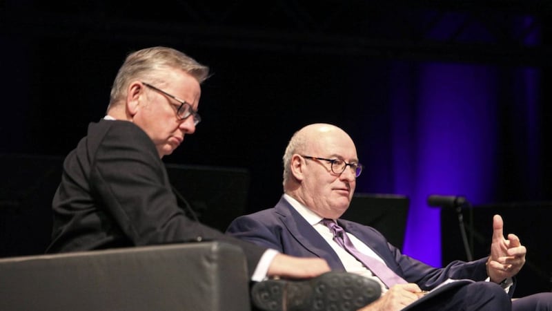Environment Secretary Michael Gove and EU Commissioner for Agriculture and Rural Development Phil Hogan address yesterday&#39;s world dairy summit in Belfast. Photo: Ann McManus 