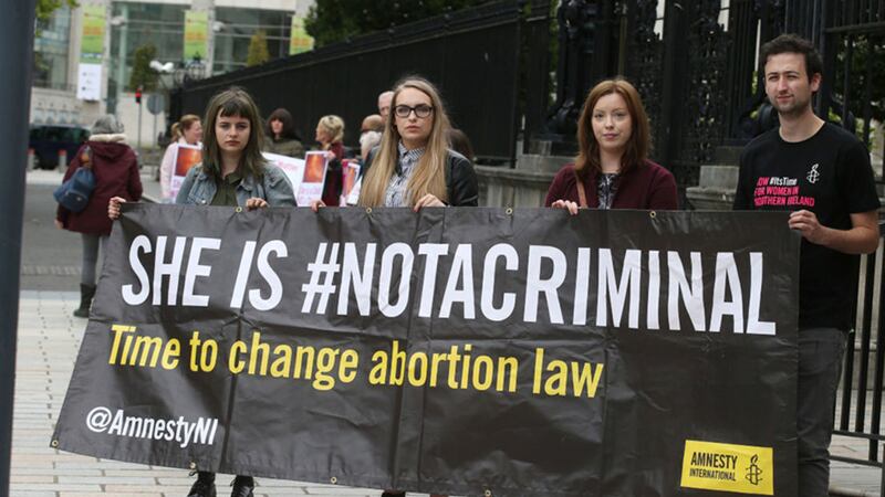 Protesters outside the High Court in Belfast as a landmark legal challenge into the north's abortion laws takes place. Picture by Hugh Russell&nbsp;