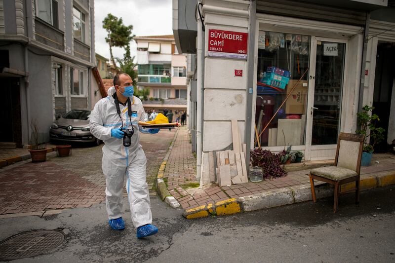 A forensics officer works near the church after the fatal attack (Emrah Gurel/AP)