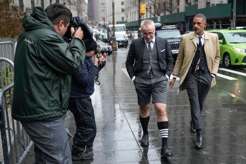 Fashion designer Thom Browne, second from right, arriving at Manhattan federal court in New York