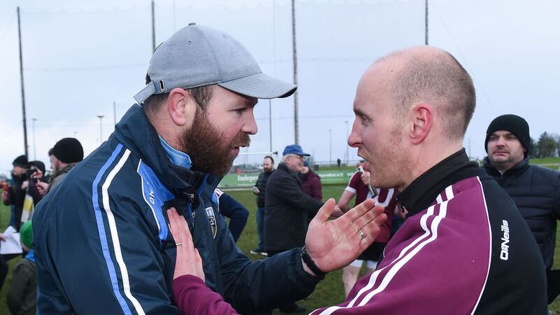 St Mary's manager Paddy Tally takes the congratulations of UCD counterpart John Divilly<br />Picture by Sportsfile