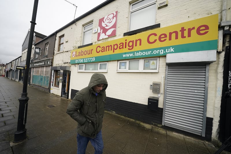 A man walks past Labour’s campaign centre in Rochdale, Greater Manchester