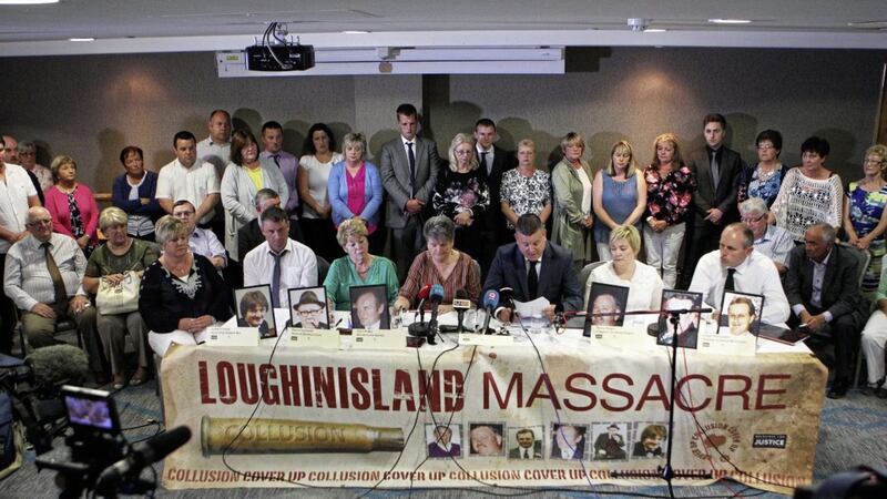 Relatives and victims of the Loughinisland Massacre pictured last year as a statement is read out by Niall Murphy, their legal representative to the waiting media about the evidence of collusion between police and Loyalist Paramilitaries. Picture Matt Bohill.