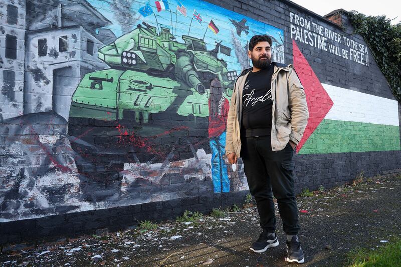 Belfast born Palestinian Khalid El-Estal (30) pictured at a pro-Palestinian mural in west Belfast, his wife, Ashwak Jendia, was killed in Gaza along with his mother, brother, uncle and two cousins, his children Ali (4) and Sara (1) are still in Gaza with their grandparents. PICTURE: MAL MCCANN