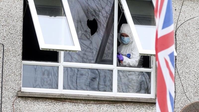 Police and forensic officers carry out investigations after an arson attack on a property in Portlee Walk in Antrim. Picture Mal McCann. 
