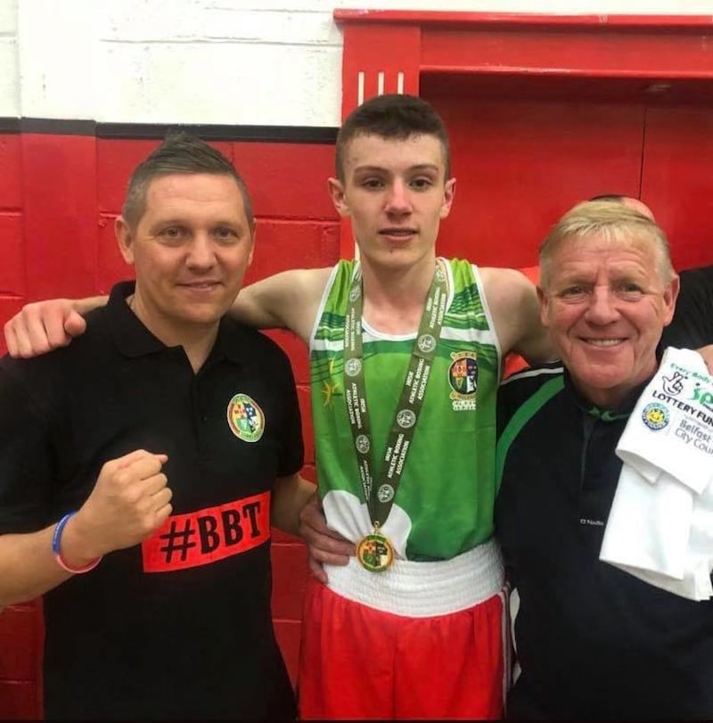John McConnell (centre), pictured with Holy Trinity coach Michael Hawkins and Liam Cunningham (Saints) after his Irish Cadet championship success
