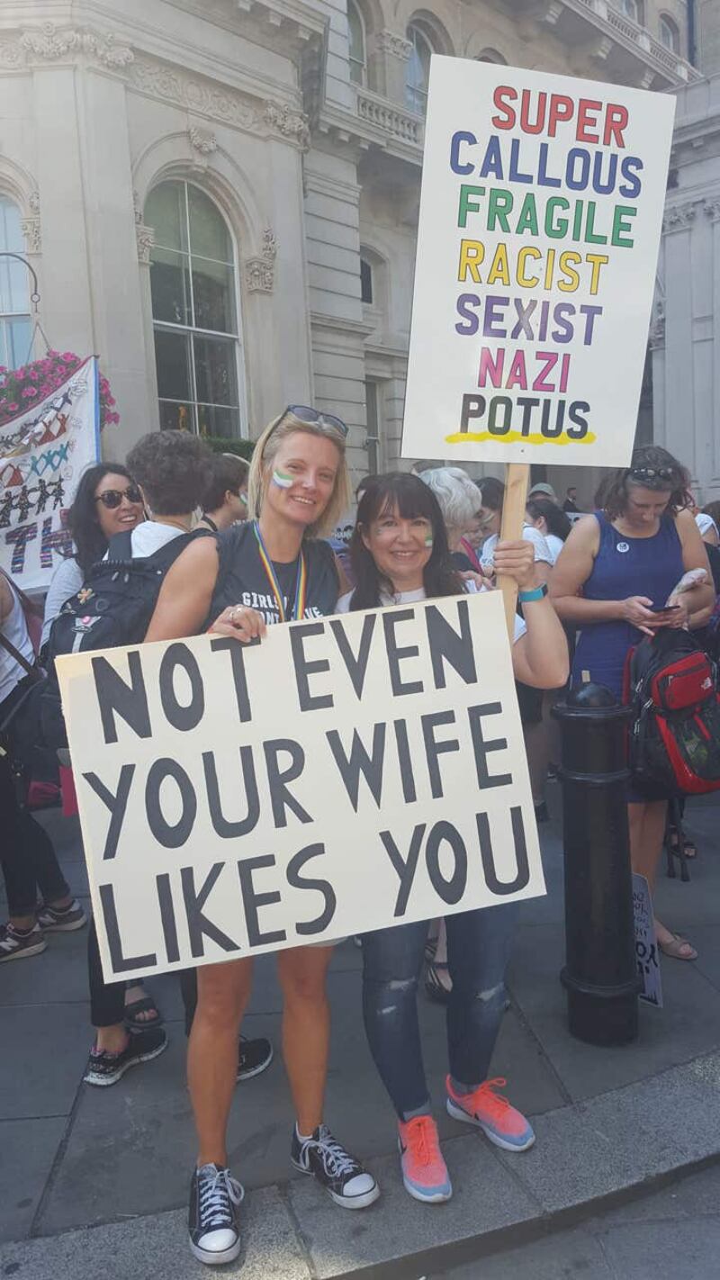 TV comedy writer Lucy Guy (left), 41, with Emily Darnell, 40, hold signs in London, as part of the protests against the visit of US President Donald Trump to the UK.