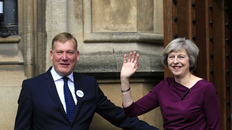 Theresa May with new NIO minister Kris Hopkins outside the Palace of Westminster in London. Picture by Jonathan Brady, Press Association &nbsp;