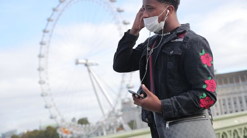 &nbsp;A man in a face mask in London, after Prime Minister Boris Johnson set out a new three-tier system of alert levels for England following rising coronavirus cases and hospital admissions.