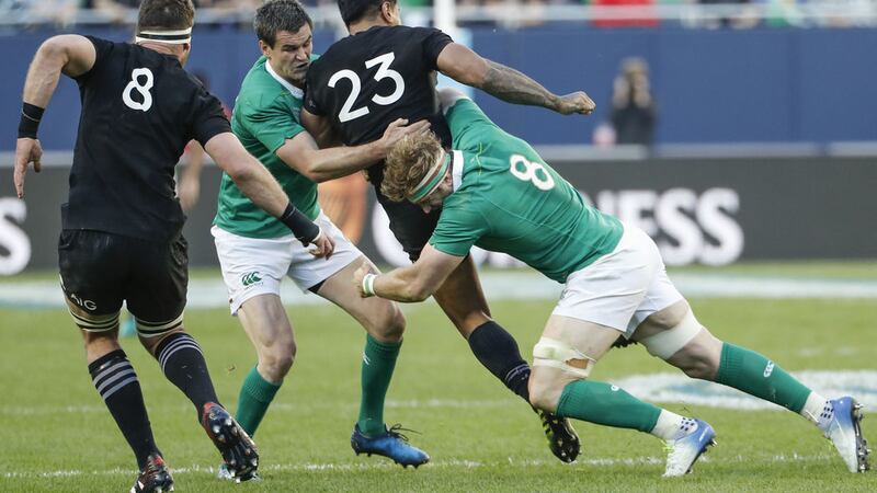 Ireland's Johnny Sexton, second from left, and Jamie Heaslip, right, defend against New Zealand's Malakai Fekitoa, second from right, &nbsp;