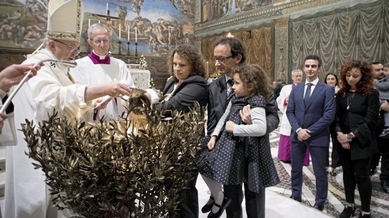 Pope Francis, who baptised children in the Sistine Chapel this week, has encouraged parents to make sure the &quot;language of love&quot; is spoken at home. Picture by L&#39;Osservatore Romano/Pool Photo via AP 