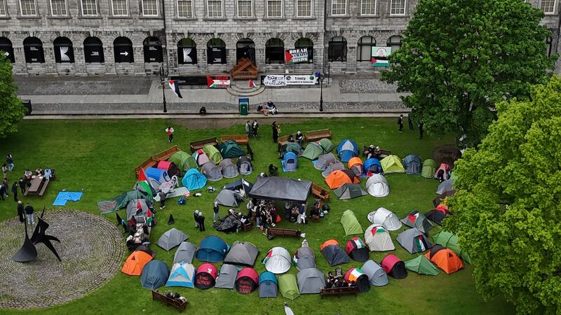 Students taking part in an encampment protest over the Gaza conflict on the grounds of Trinity College in Dublin