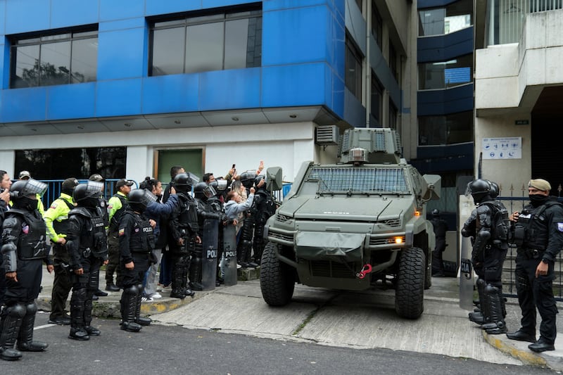 A military vehicle transports former Ecuadorian vice president Jorge Glas from the detention centre where he was held after police broke into the Mexican Embassy in Quito to arrest him (Dolores Ochoa/AP)