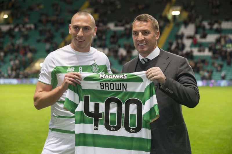 Celtic's Scott Brown collects a shirt from manager Brendan Rodgers for his 400th appearance before the Ladbrokes Scottish Premiership match at Celtic Park&nbsp;