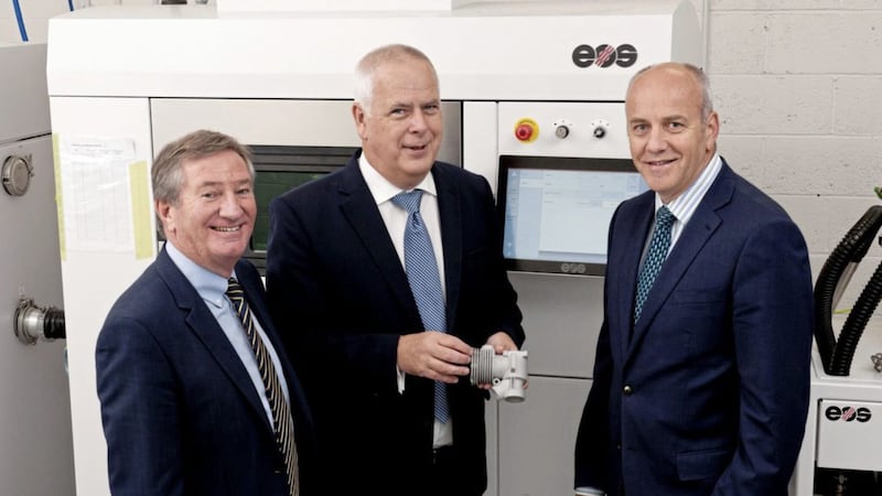 Bill Montgomery of Invest Northern Ireland and Dr Leslie Orr of ADS Northern Ireland join Tom Walls of Laser Prototypes Europe (LPE) with LPE&#39;s new &pound;500,000 metal sintering machine 