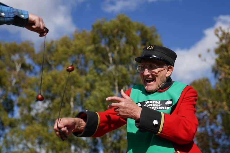 Chelsea pensioner John Riley, 92, takes part in the annual World Conker Championships at the Shuckburgh Arms in Southwick, Peterborough 