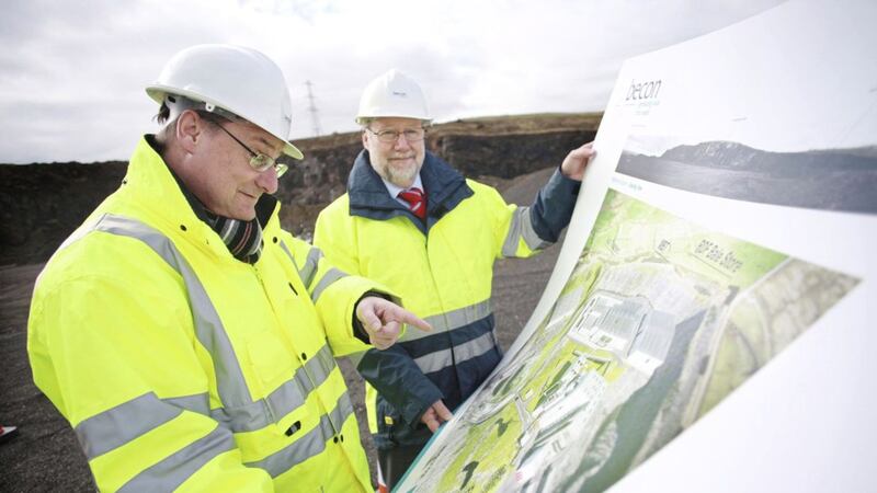 Ricky Burnett of arc21 and Ian Smith of the Becon Consortium look over the plans for the site at Hightown Quarry in 2013. Picture by Becon Project/PA Wire 