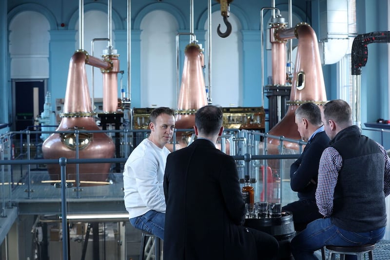 Ryan McAleer speaks with Titanic Distillers' Stephen Symington and Damien Rafferty in the surrounds of the historic Thompson pump house.