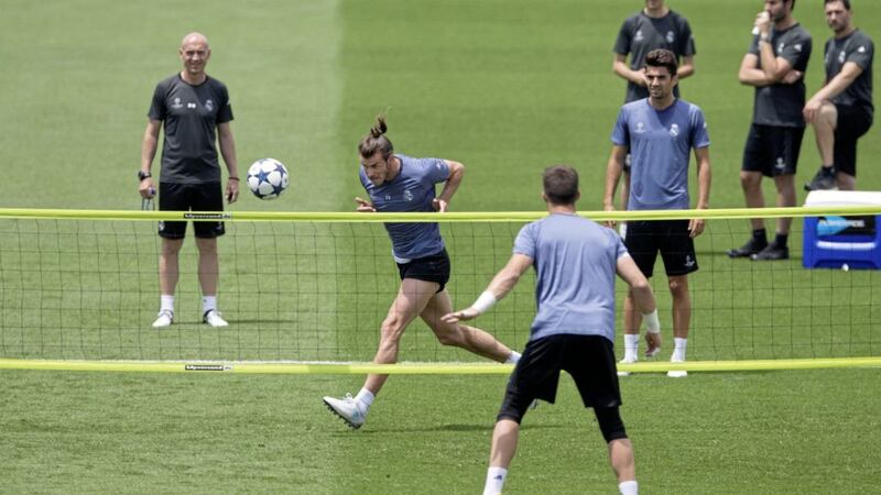 Real Madrid&#39;s Gareth Bale heads a ball during a training session at a media open day in Madrid on Tuesday 