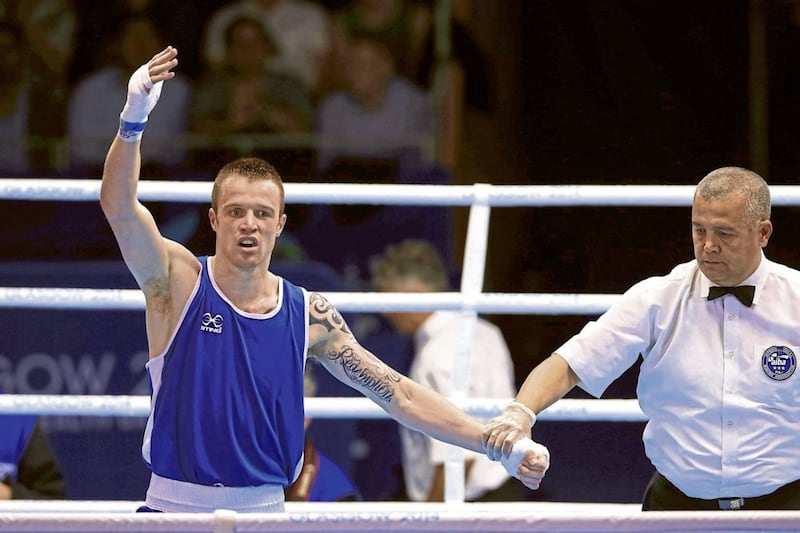 Steven Donnelly celebrates after beating pre-competition favourite Custio Clayton at the 2014 Commonwealth Games. Picture by PA 