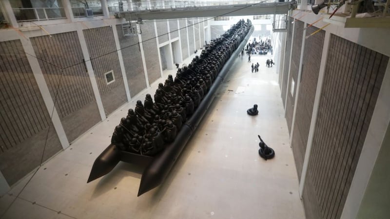 The 70-meter-long black rubber boat has debuted in Prague.