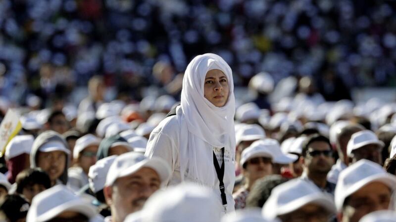 Worshippers at the Zayed Sports City Stadium as they wait for the arrival of Pope Francis in Abu Dhabi Picture by Andrew Medichini/AP 