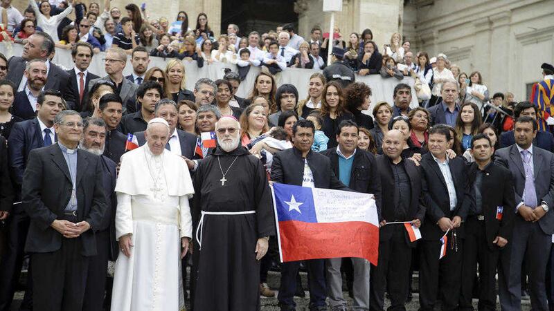 Pope Francis with some of the 33 Chilean miners who were rescued from the 2010 mining accident as they visit the Vatican on Wednesday. Picture by Gregorio Borgia/AP