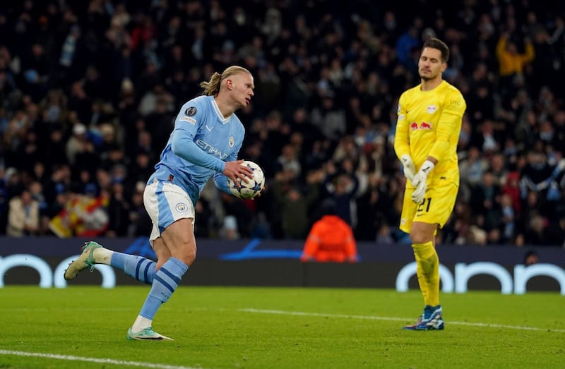 Erling Haaland runs the ball back to halfway after scoring City's first goal