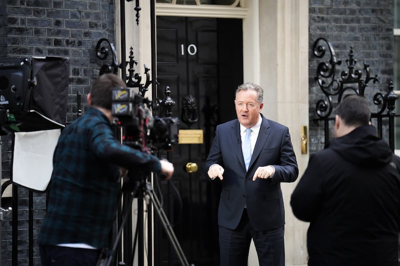 Piers Morgan filming in front of the door to 10 Downing Street