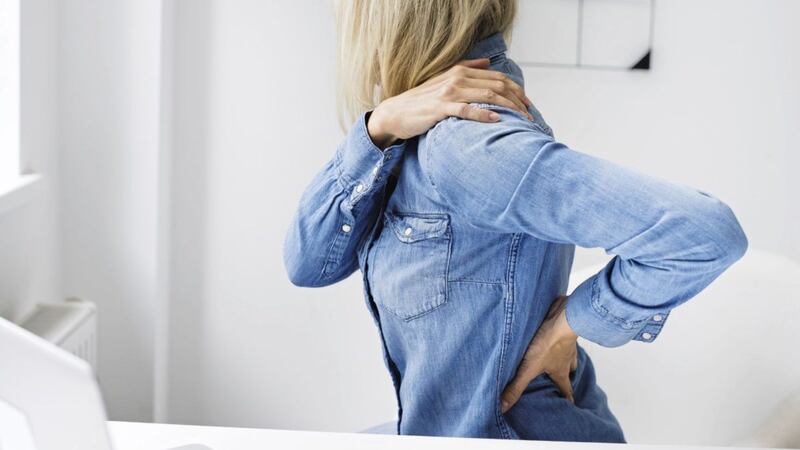 Months of home working at makeshift desks during the pandemic has led to many people experiencing back pain 