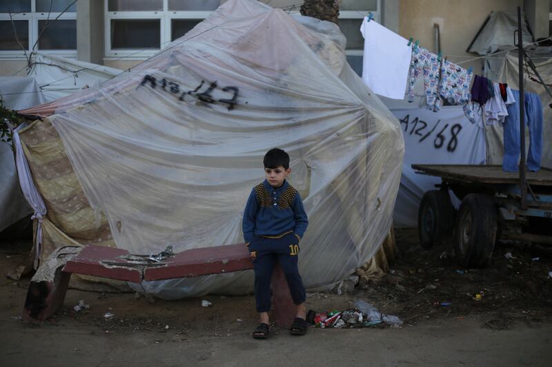 Palestinians take shelter from the Israeli bombardment in Khan Younis (Hatem Ali/AP)