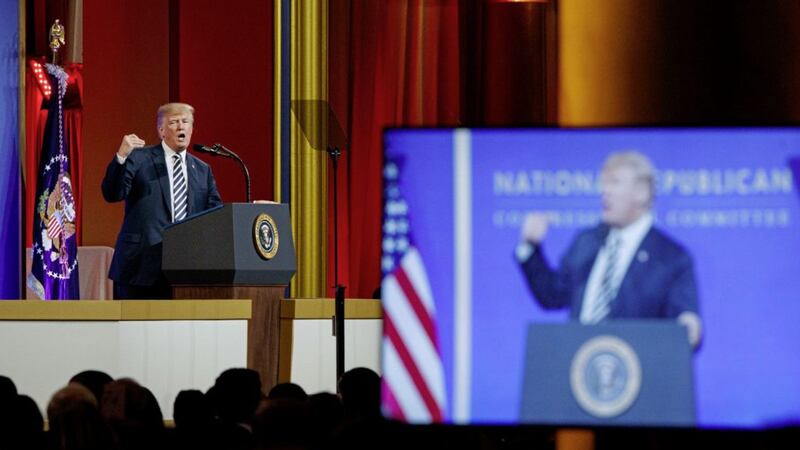               President Donald Trump speaks to the National Republican Congressional Committee March Dinner, at the National Building Museum Tuesday, March 20, 2018, in Washington. (AP Photo/Evan Vucci)             