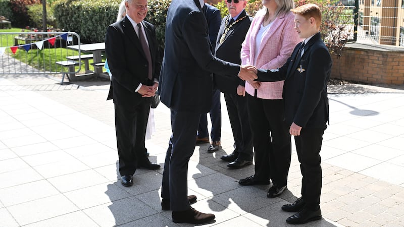 The Prince of Wales speaks to Freddie Hadley, 12, who made the initial invitation to visit St Michael’s Church of England High School in Sandwell, West Midlands