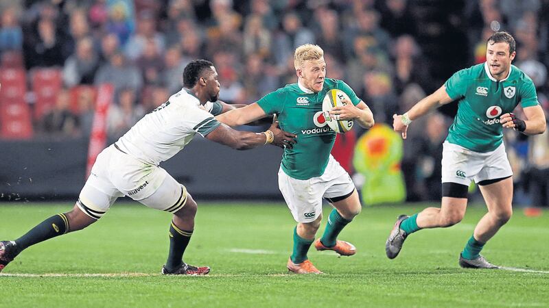 &nbsp;Stuart Olding (centre) avoids a tackle from Siya Kolisi during their second rugby test match at Ellis Park stadium in Johannesburg on Saturday<br />Picture by AP