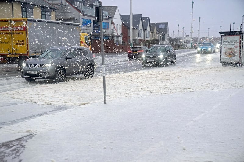 Sea foam covers a road in Seaburn, Sunderland, as Storm Babet batters the country