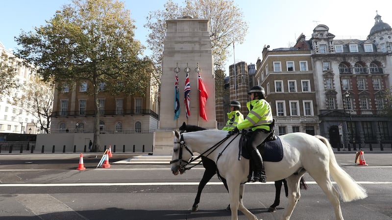 Metropolitan Police on horseback riding past the Cenotaph (Yui Mok/PA)