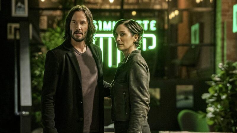 The Matrix Resurrections: Keanu Reeves as Neo/Thomas Anderson and Carrie-Anne Moss as Trinity 