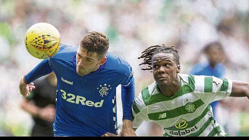 Celtic&#39;s Dedryck Boyata (right) and Kyle Lafferty of Rangers playing at the Old Firm encounter on September 2 